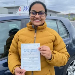 Wiz Driving School Manchester Wall of Fame, student passes driving test with certificate