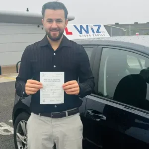 Wiz Driving School Manchester Wall of Fame, student passes driving test with certificate
