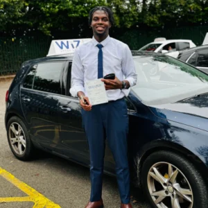 Wiz Driving School Manchester Wall of Fame, student passes driving test with certificate