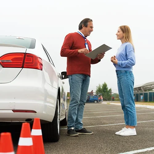 DVSA-approved driving instructor in Manchester teaching a learner driver during a practical driving lesson.